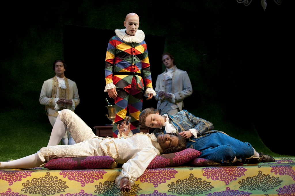 Viola in disguise (Brooke Parks) discovers an affection for Orsino (Kenajuan Bentley), as Feste (Michael Elich, center), Curio (Fune Tautala Jr., back left) and Valentine (Jorge Paniagua) look on. Photo by T. Charles Erickson.